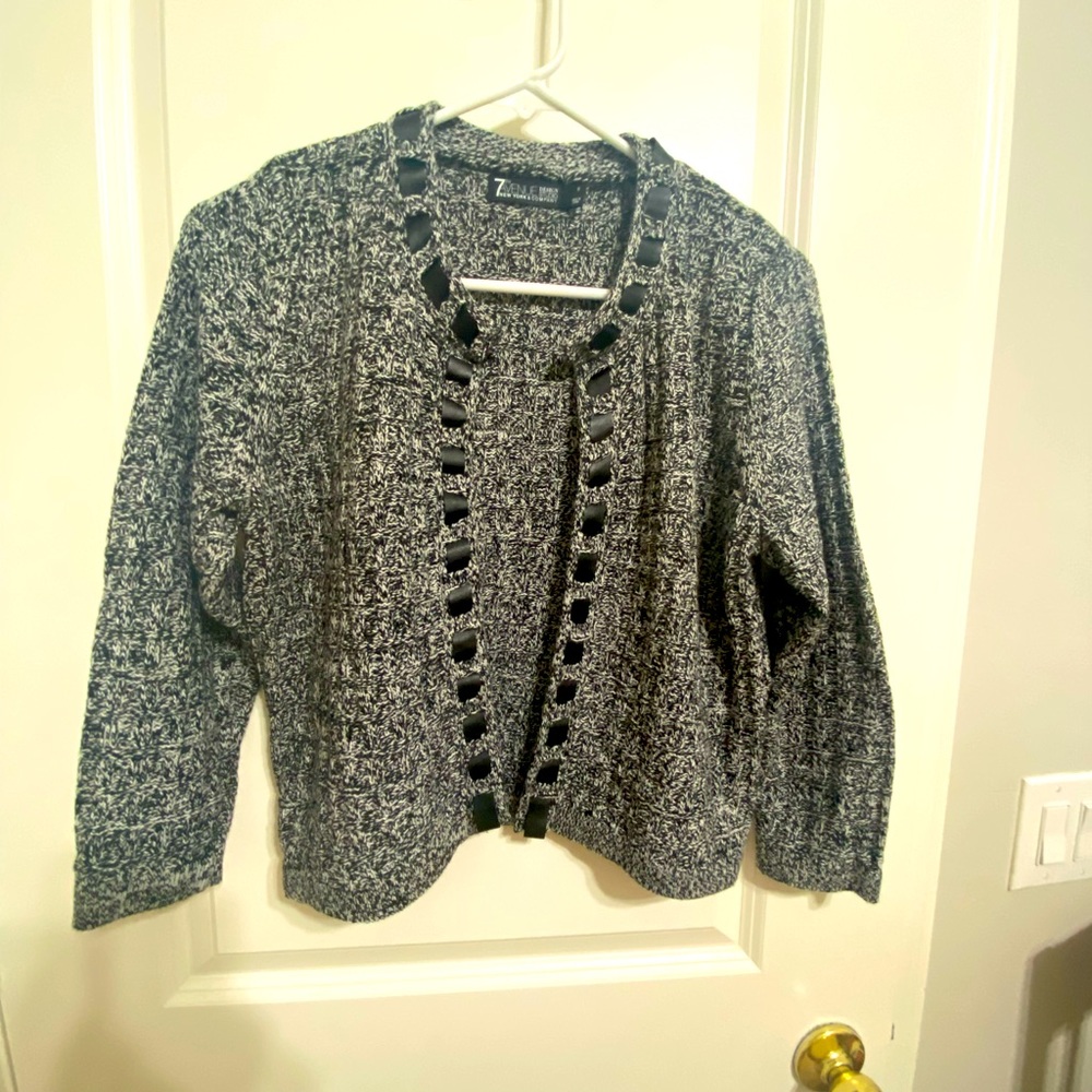 Marbled white, black, gray cardigan. Sits at waist. Cute black weave detail.